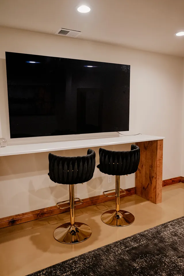 The Ember Suite bar and TV wall
