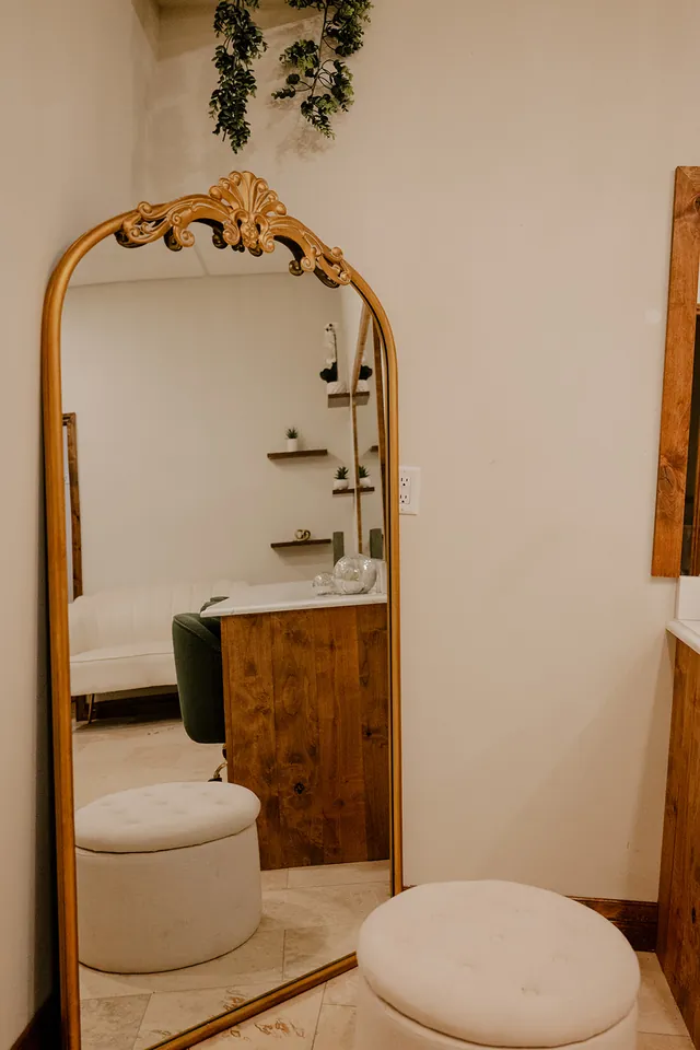 The gold floor mirror in the Opal Suite