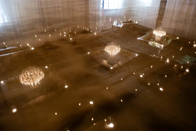 Chandelier reflections on the polished floor